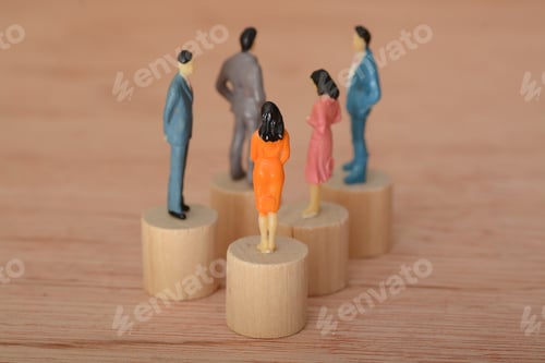 Preview: Miniature People Figures on Wooden Background