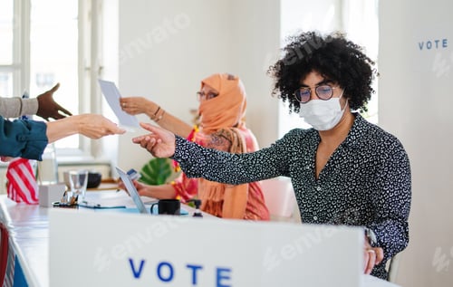 Preview: People with face masks voting in polling place, usa elections and coronavirus