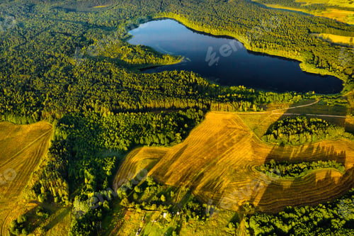 Preview: Top view of Bolta lake in the forest in the Braslav lakes National Park at dawn, the most beautiful