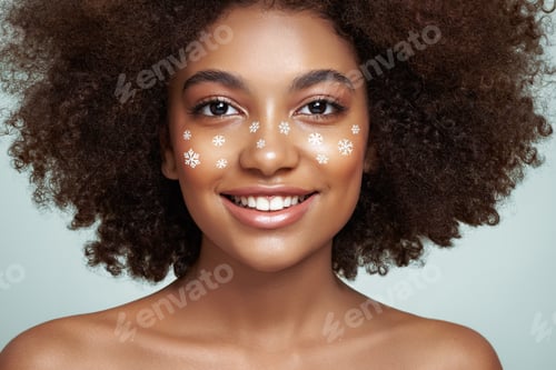 Preview: Beauty portrait of African girl with snowflakes her face