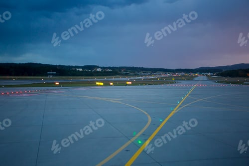 Preview: Landing lights at night on airport runway