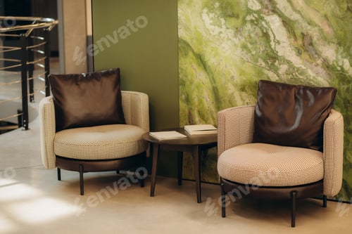Preview: Modern fireplace and sofas in bright living room. Luxury apartment with panoramic windows.