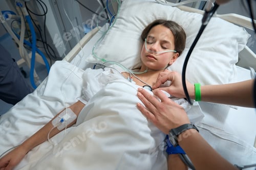 Preview: Nurse checking condition of patient lungs in ward