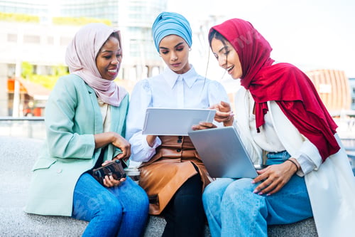 Preview: Beautiful muslim girl wearing hijab bonding outdoors