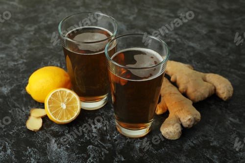 Preview: Glasses of ginger beer and ingredients on black smoky background
