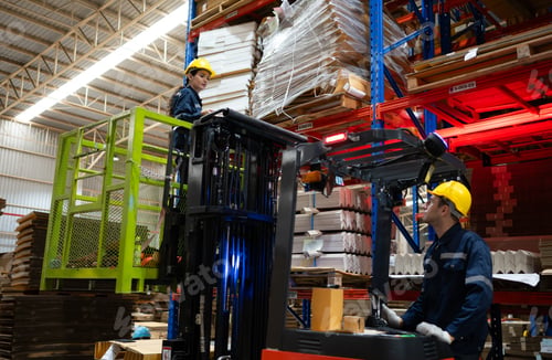 Preview: Warehouse workers using forklift to check and counting in a large warehouse.