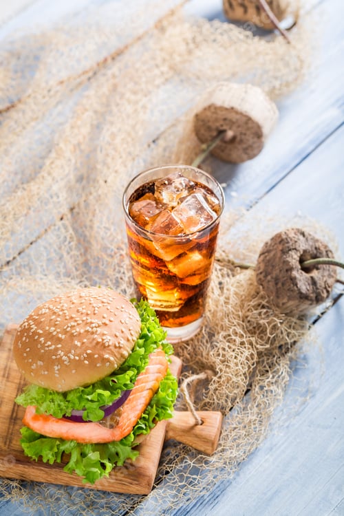 Preview: Homemade burger with fish made by fisherman on old wooden table