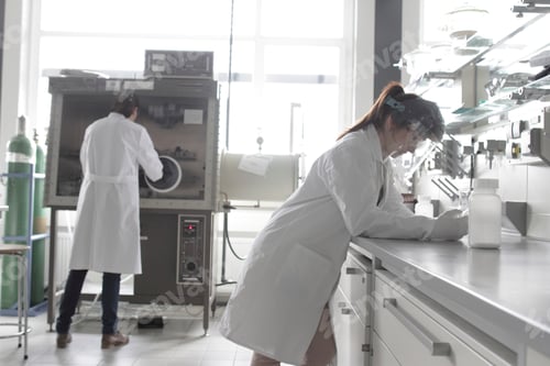 Preview: Two young female chemistry students in lab
