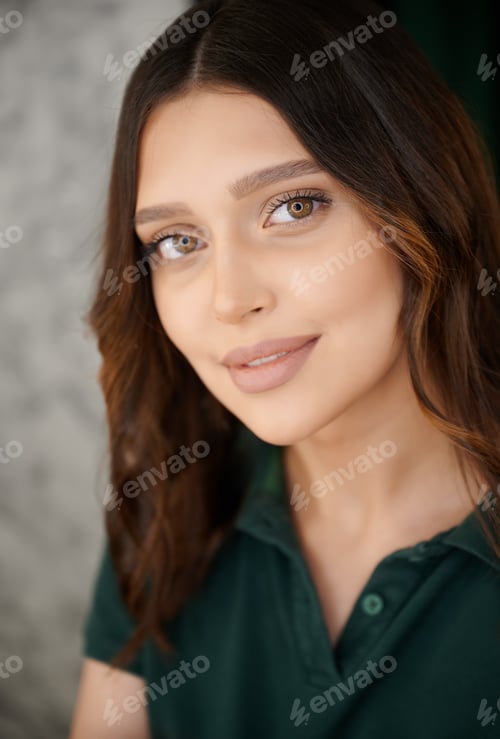 Preview: Portrait of charming woman demonstrating makeup.