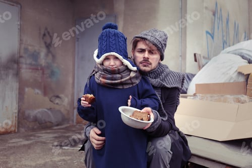 Preview: Poor father and child with bread at dump
