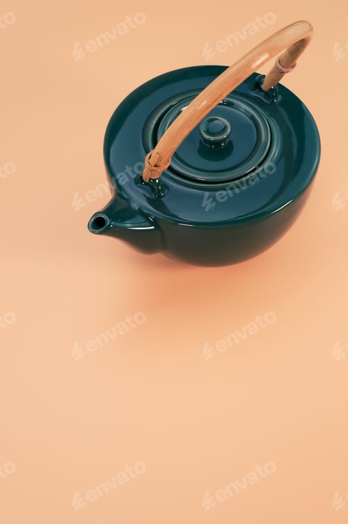 Preview: Vertical shot of a beautiful kettle on a coral background
