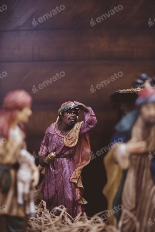 Preview: Vertical closeup shot of religious figurines with a blurred background