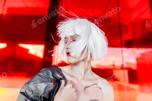 Preview: Stylish blonde on a red background.