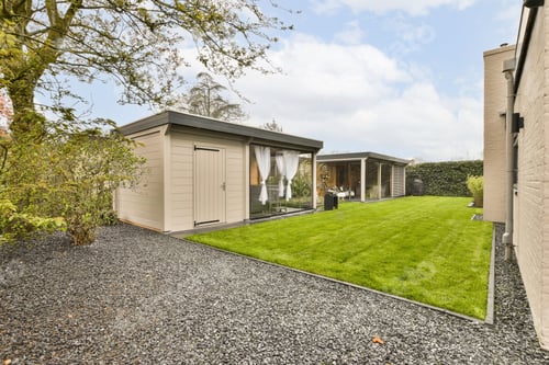 Preview: a garden with a shed and a lawn with grass