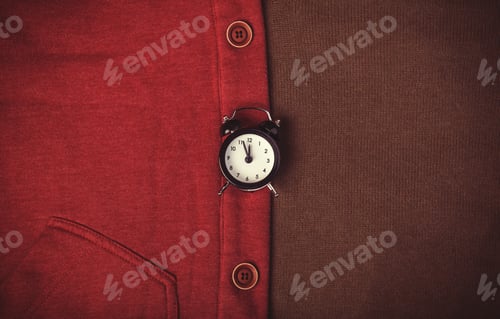 Preview: Retro alarm clock and part of clothes.