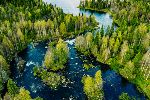 Preview: Aerial view of fast river in beautiful green spring forest in Finland.