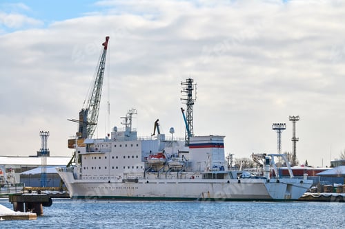 Preview: Moored ships and harbor cranes in port