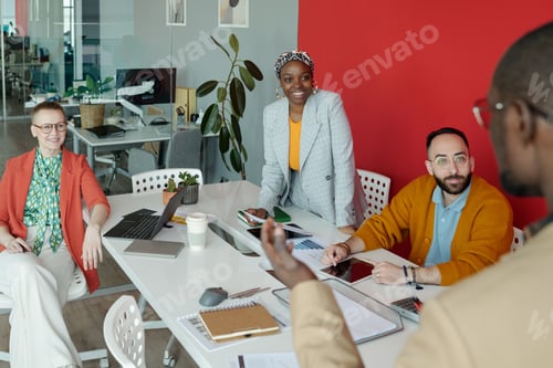 Preview: Diverse Team Collaborating in Modern Office Meeting