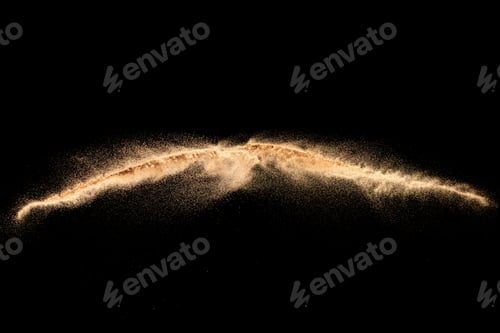 Preview: Sand explosion isolated on black background. Freeze motion of sandy dust splash.