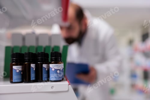 Preview: Selective focus of essential oil on pharmacy shelves is ready to be buy by client