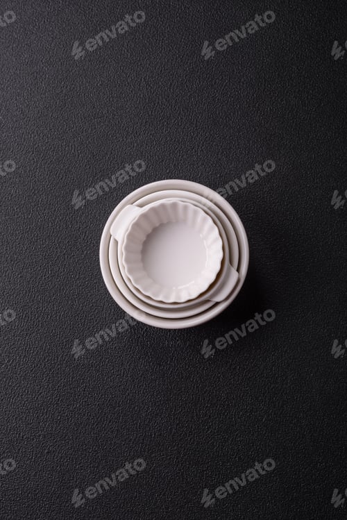 Preview: Beautiful empty white ceramic gravy boat on a concrete background