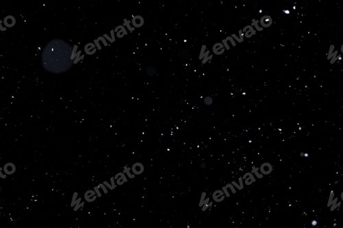 Preview: Element for winter design or overlay. Real snow over black background.