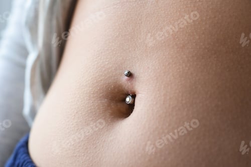 Preview: Closeup on belly button piercing