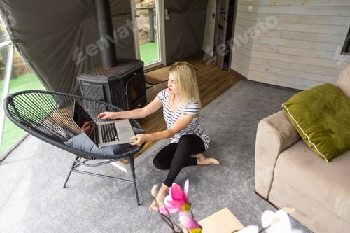 Preview: Image of young pleased happy cheerful cute beautiful business woman using laptop computer listening
