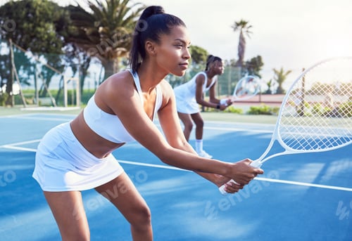 Preview: The opportunity to play. Shot of two attractive young women standing together while playing tennis.