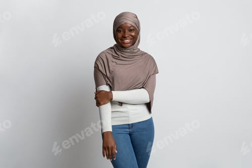 Preview: Smiling Woman in a Head Scarf Poses