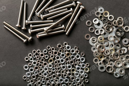 Preview: Metal nuts and bolts close up on black background