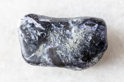 Preview: sample of tumbled antimonite mineral on white