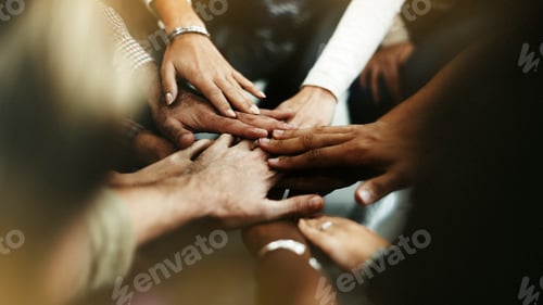 Preview: Closeup of diverse people joining their hands