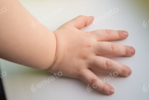 Preview: Child hand showing the five fingers isolated on a white background