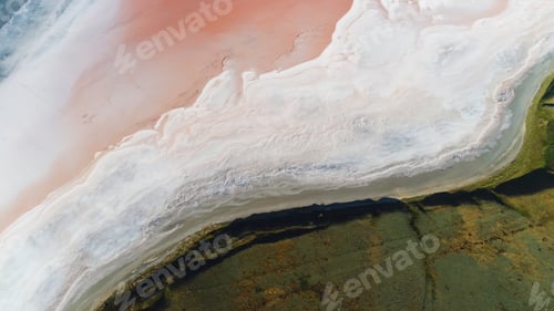 Preview: Top view of the dead salt sea edge near green grass, the beauty of nature. Shot. Aerial for green