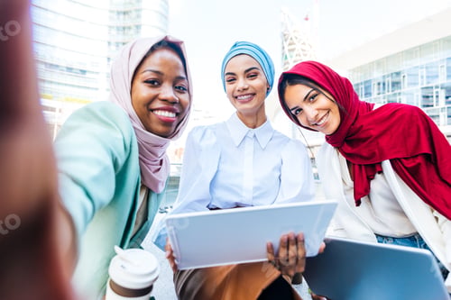 Preview: Beautiful muslim girl wearing hijab bonding outdoors