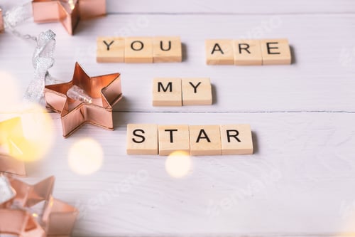 Preview: Wooden alphabet blocks say You are my star on table