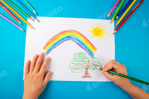 Preview: Child's hands coloring a picture of a rainbow with crayons