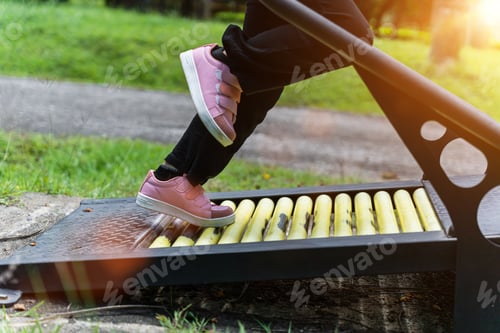 Preview: Close up of Child girl running on a treadmill for exercise at the playground in park outdoor