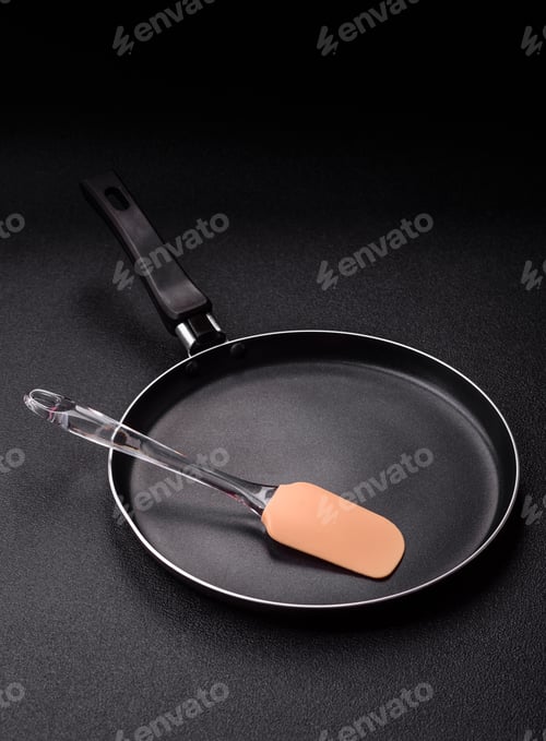 Preview: An empty black metal frying pan, kitchen utensils for cooking. An empty frying pan