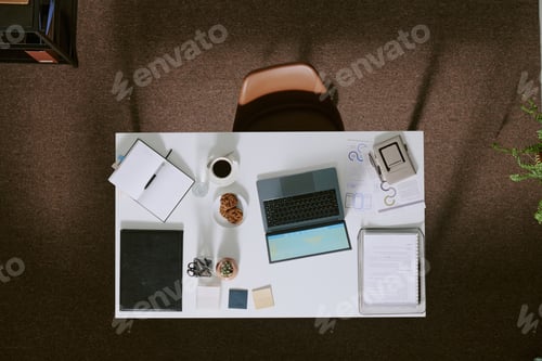 Preview: Overhead View of Organized Office Workspace with Laptop