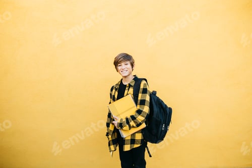 Preview: A schoolboy against a yellow background