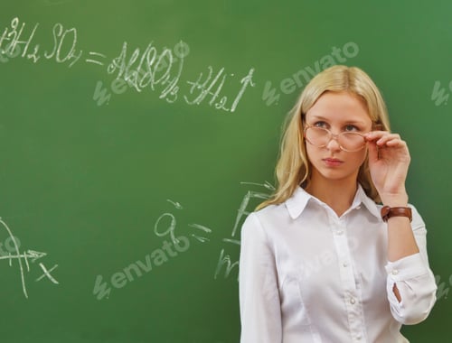 Preview: Student girl standing near blackboard
