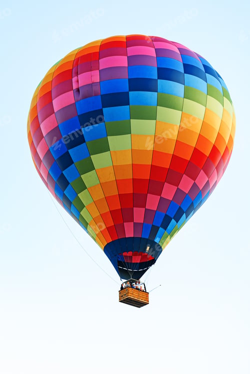 Preview: Hot air balloon floats in the sky during sunrise with colorful patterns and bright colors