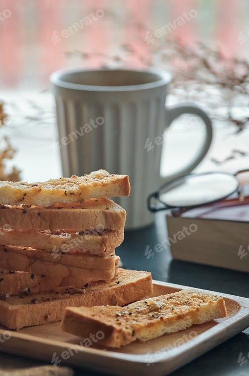 Preview: Garlic breadsticks in a wooden tray