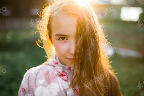 Preview: girl with long hair, portrait in the countryside at sunset