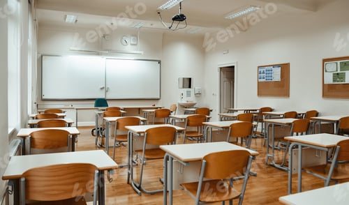 Preview: Empty school classroom with white board on wall.