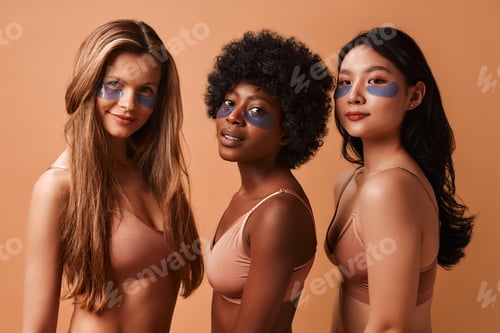 Preview: Multiethnic women on beige background