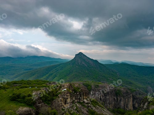 Preview: Majestic mountain range with lush greenery against the background of a cloudy sky. Georgia.