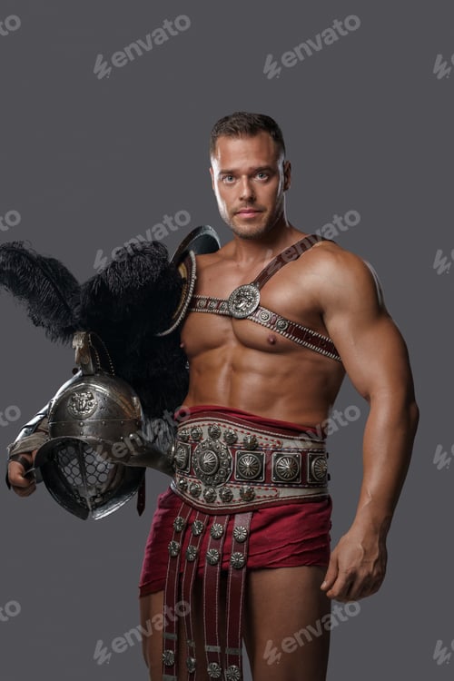 Preview: Muscular roman warrior with helmet looking at camera
